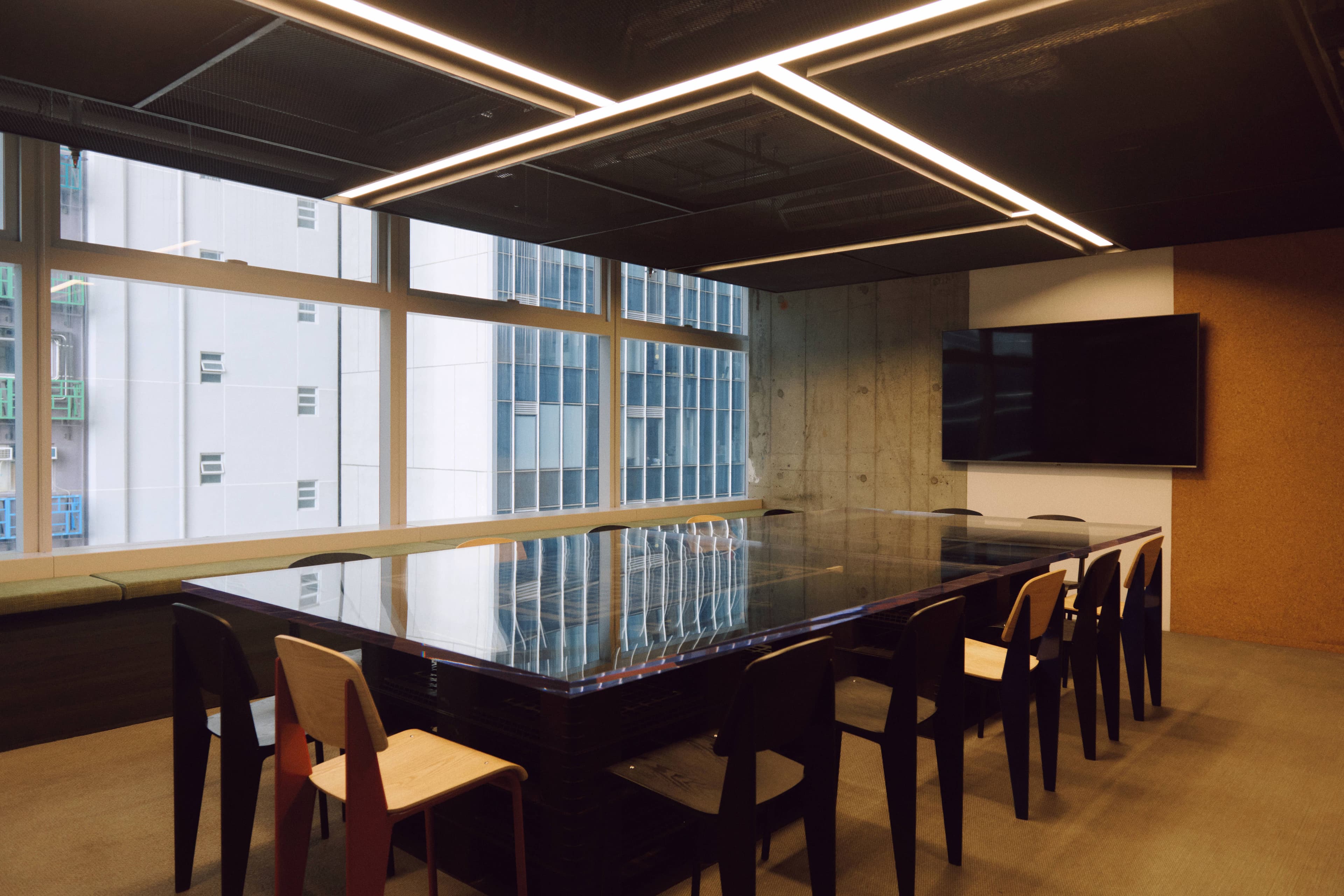 Long communal table configured for a group meeting